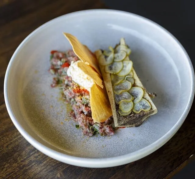 Amelia Park steak tartare, fermented chilli, creme fraiche, wood roasted bone marrow, pickled qukes, siracha crisp