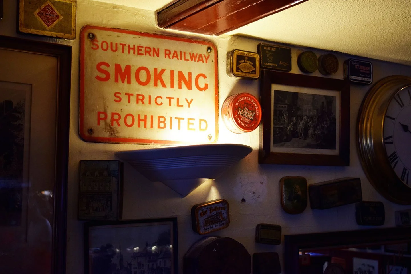 Above image; Old cans, tins, containers, photos, posters decorate the walls.