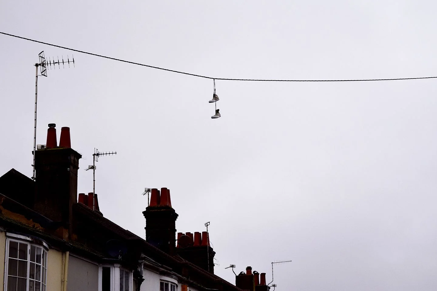 Above image; Shoes over an electric cable on my street. Somebody marking their territory?