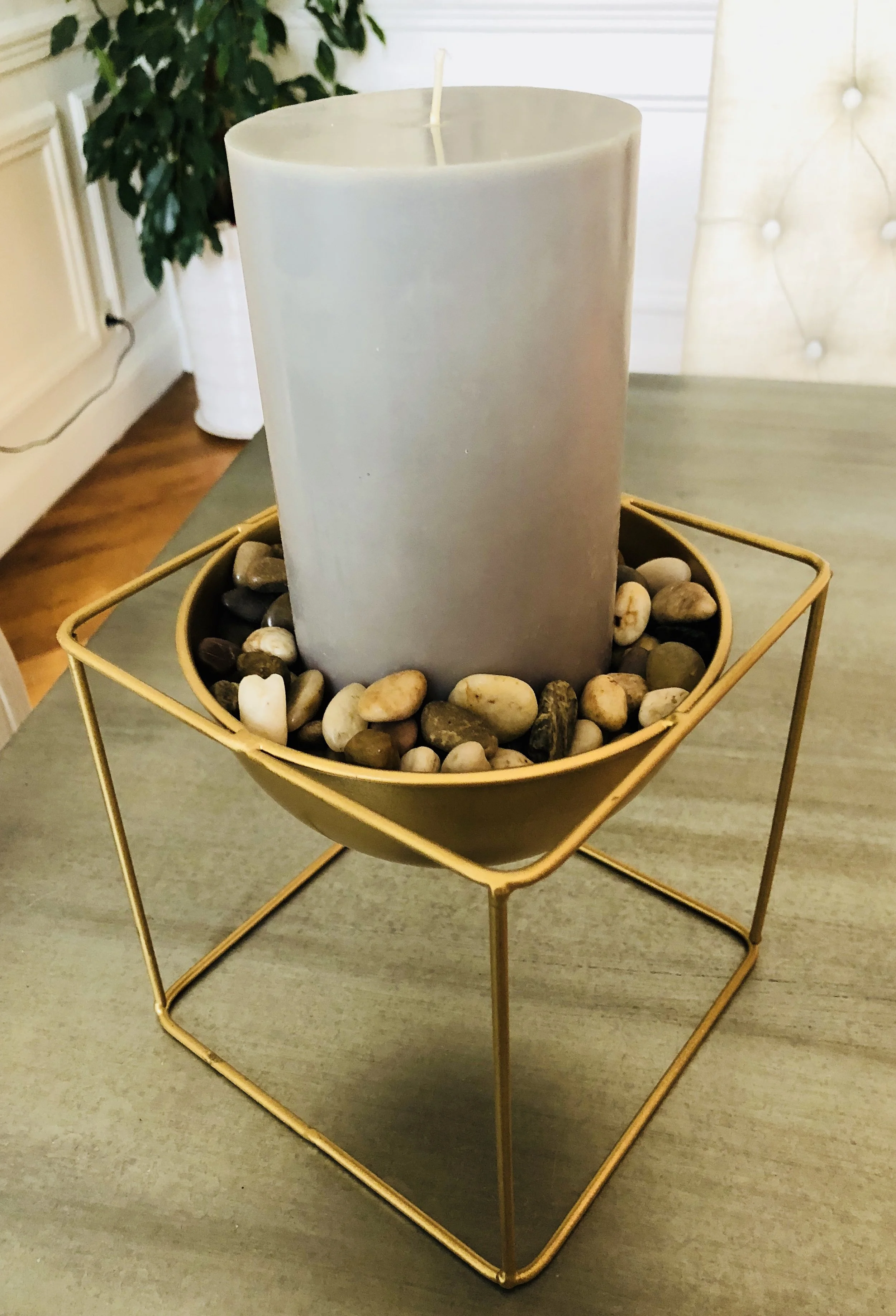 Example of a large tall fat candle, surrounded by stones. You could also do just the candle or just a the stones!