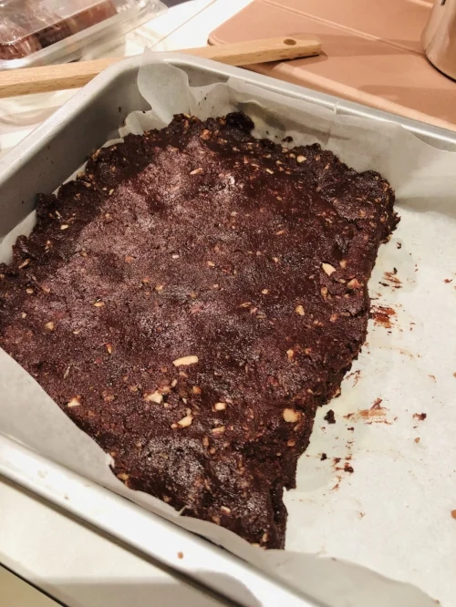 Pressed & ready to be topped with coconut & sunflower seeds