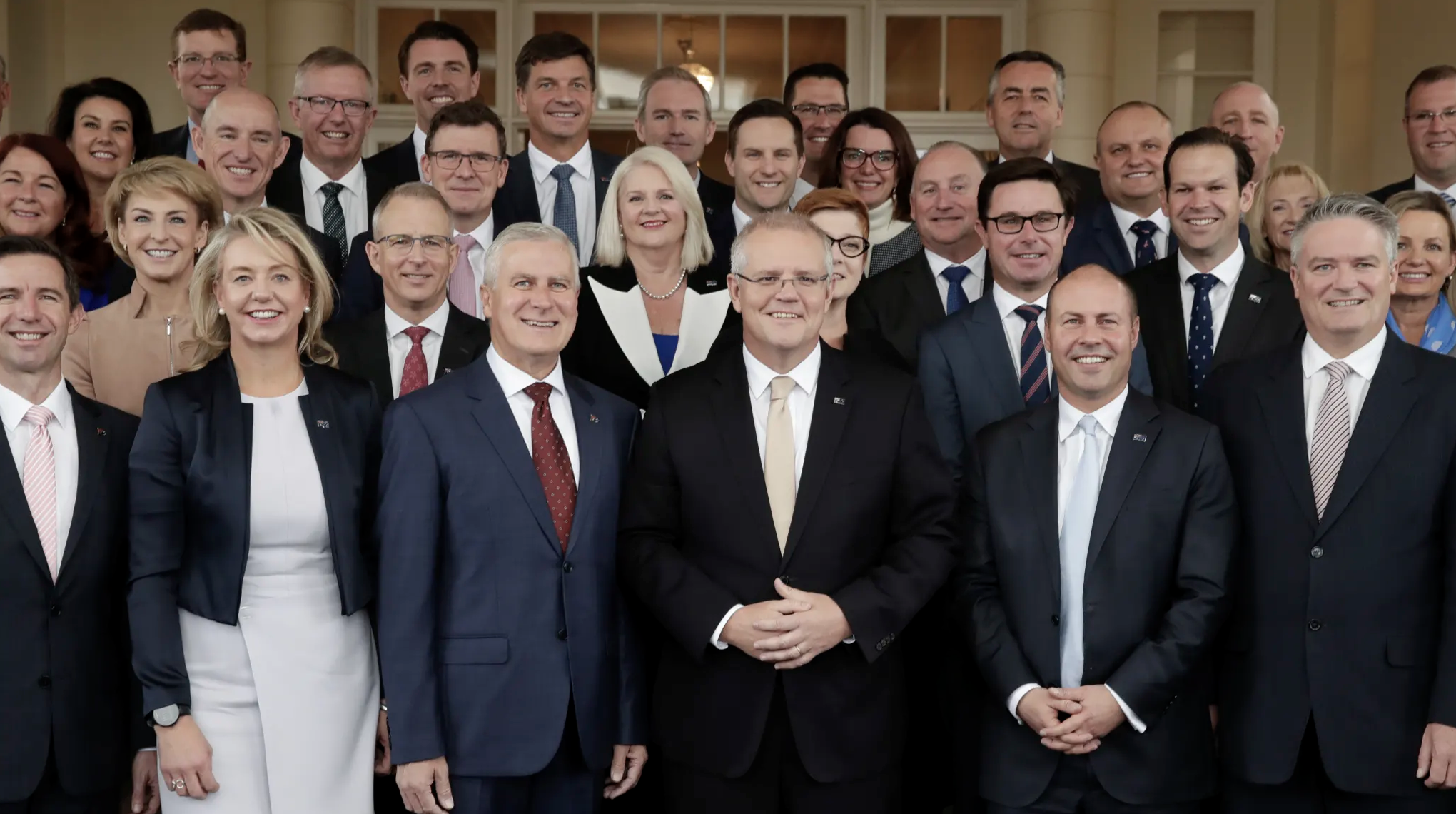 Prime Minister Scott Morrison with his new-look ministry after the swearing-in ceremony. Credit:Alex Ellinghausen
