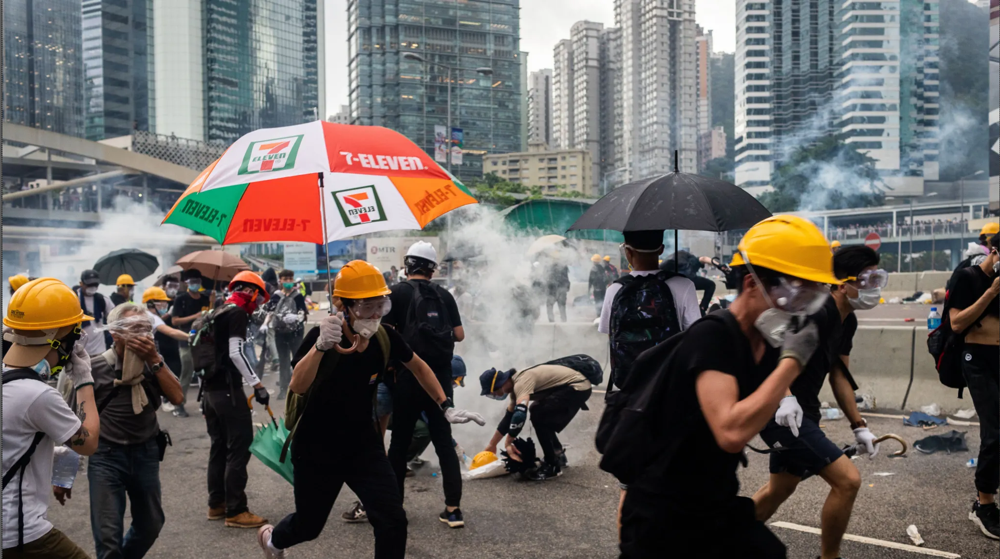 Demonstrators in Hong Kong disperse as the police fire tear gas. Credit:Bloomberg