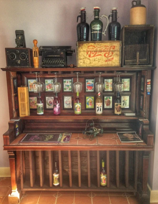 The cute piano in Clem’s tasting room with all of his hilarious labels