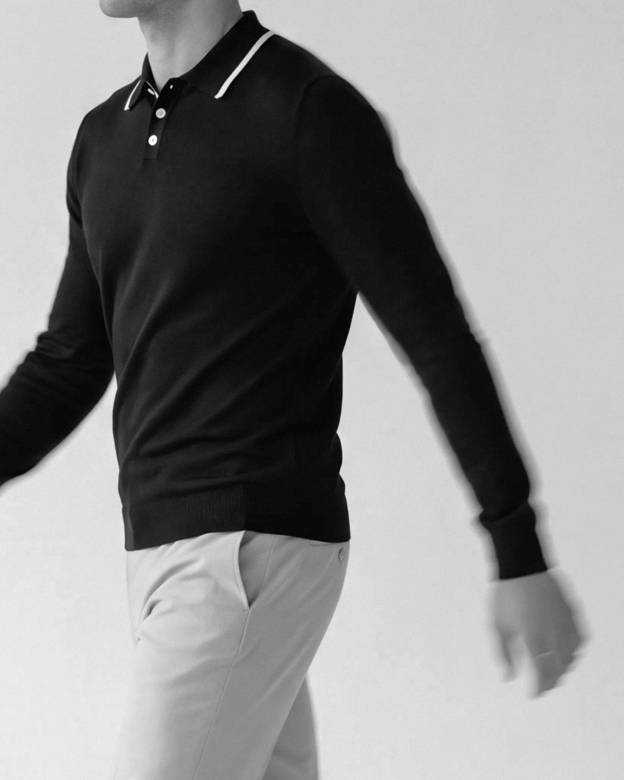 AI-made image of a model in a black Onia polo, black and white