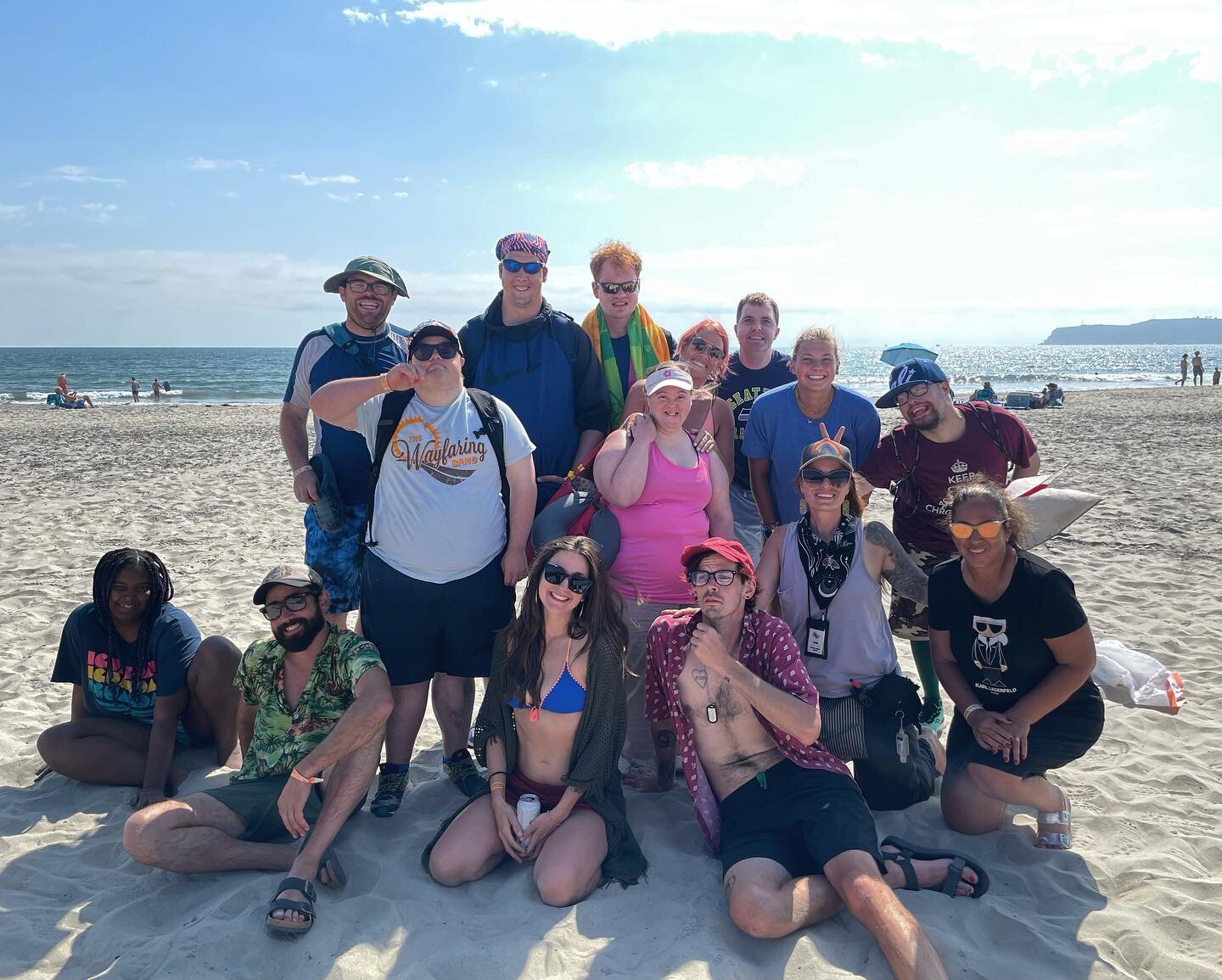 Friends forever, okay?

Image Description: The whole group of San Diego Wayfarers are standing on the sandy beach, smiling. The ocean is behind them, the sun is shining bright and the sky is blue with some clouds.