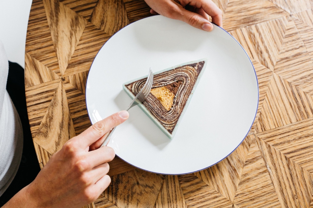 One of the cakes cut. The taste gradates from roasted almond to dark chocolate mousse and not two pieces tastes or look the same.Photo: Dunja Opalko