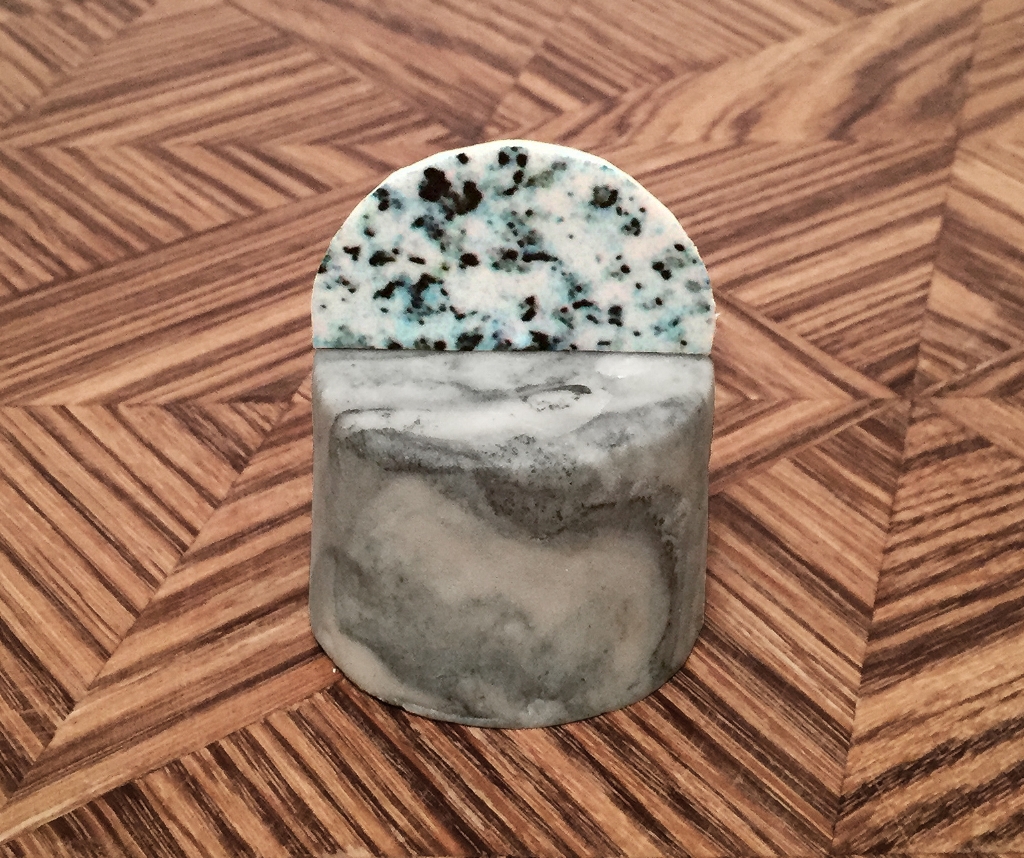  Small round cake, hand marbled marzipan, granite fondant disc. 