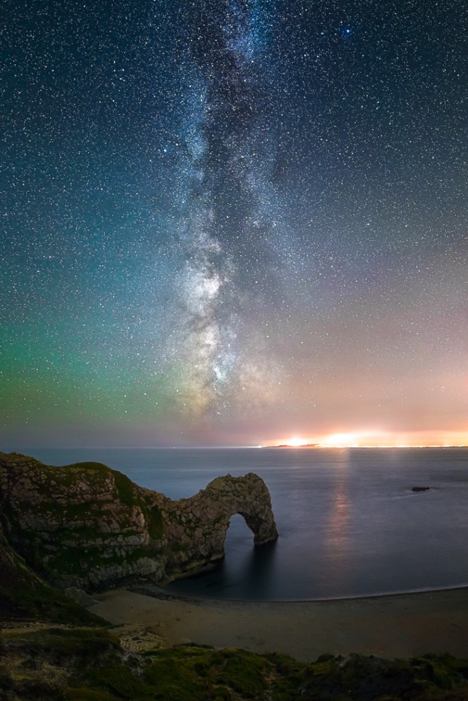 The Milky Way and a display of green airglow above Durdle Door