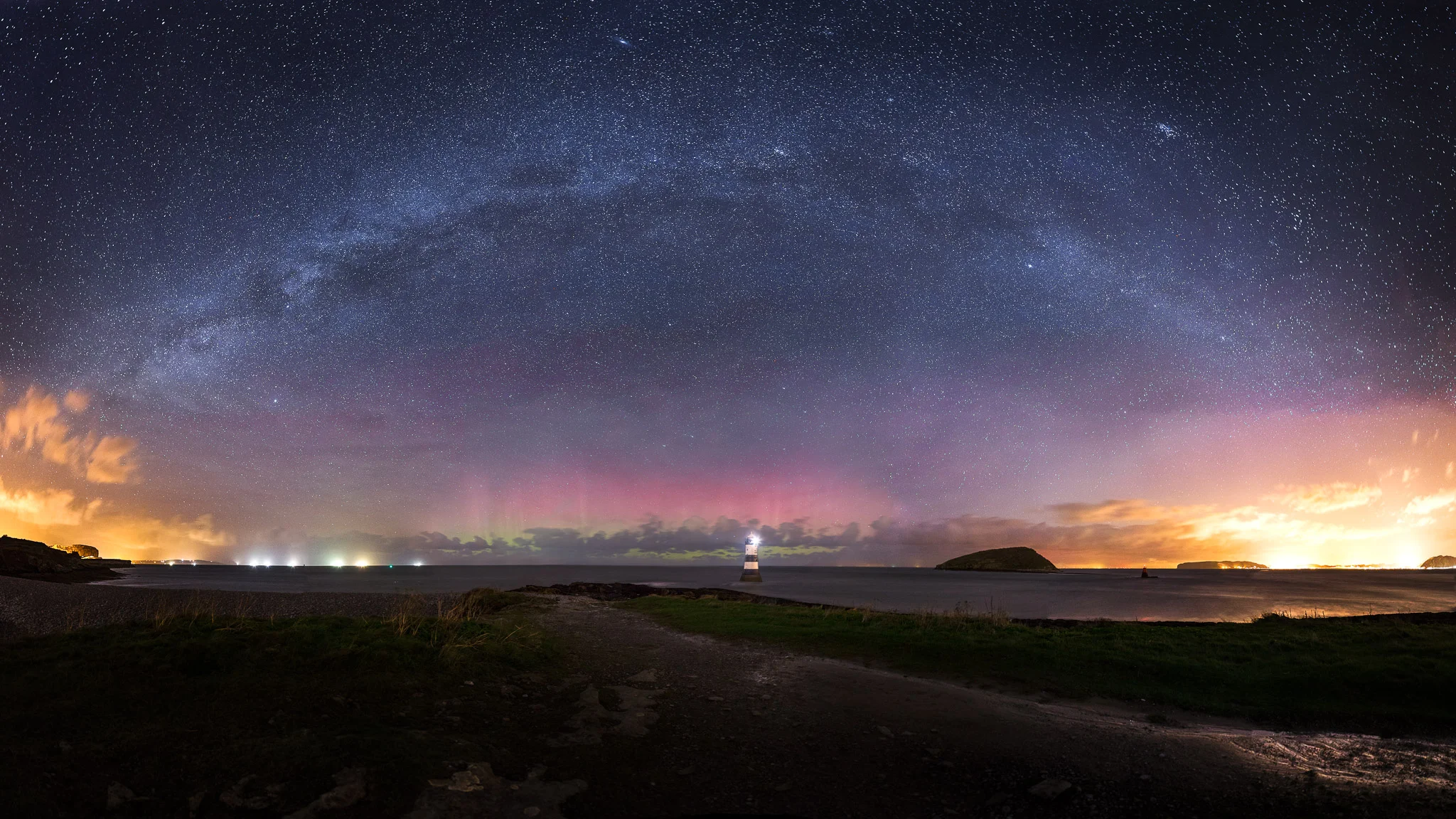 Penmon lighthouse under the Milky Way and Northern Lights