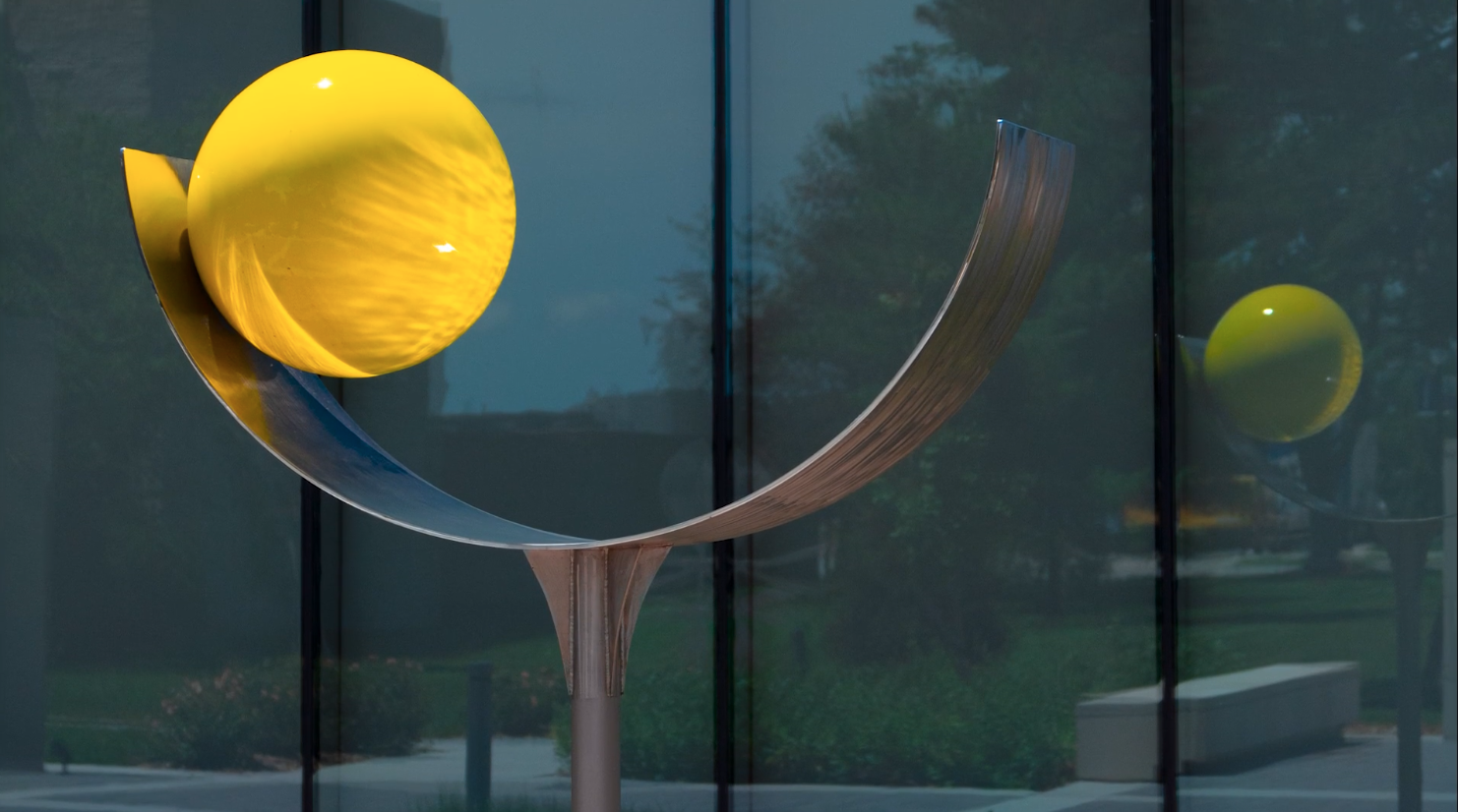 Yellow Ball (Lunar Blitt), 1975, aluminum and stainless steel, 6 x 5ft in the Rita Blitt Sculpture Garden.