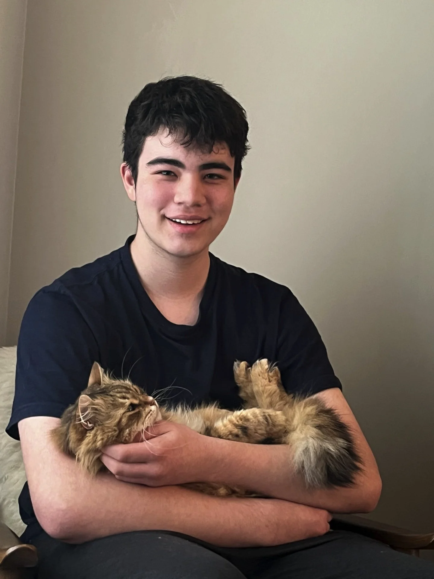 Benjamin Headshot 2025 with cat copy - NYAC CHILD-BRIGHT.jpg