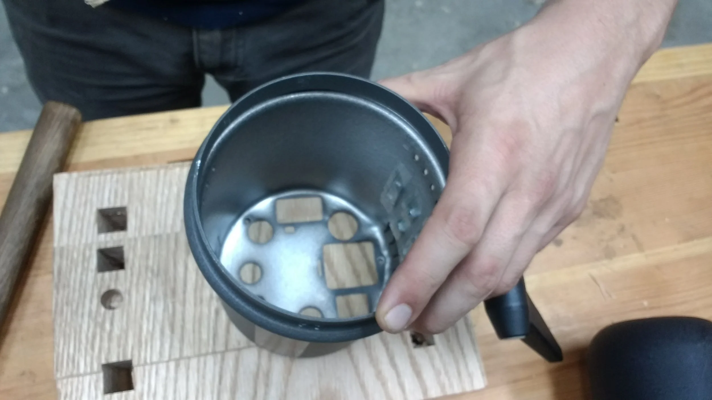 Robert hammered & flattened out the metal on the bottom using a block of wood