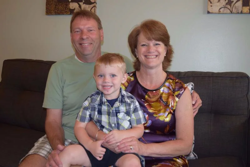 Pamela with her husband, Stan, and grandson, Jackson.