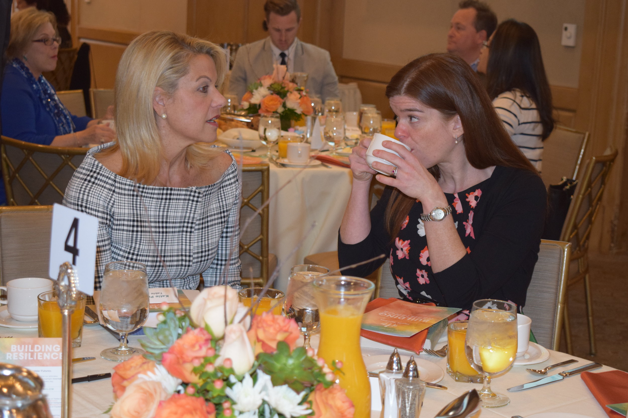  Agency volunteers Katie Prior and Sharon Stanton socialize at the breakfast. 