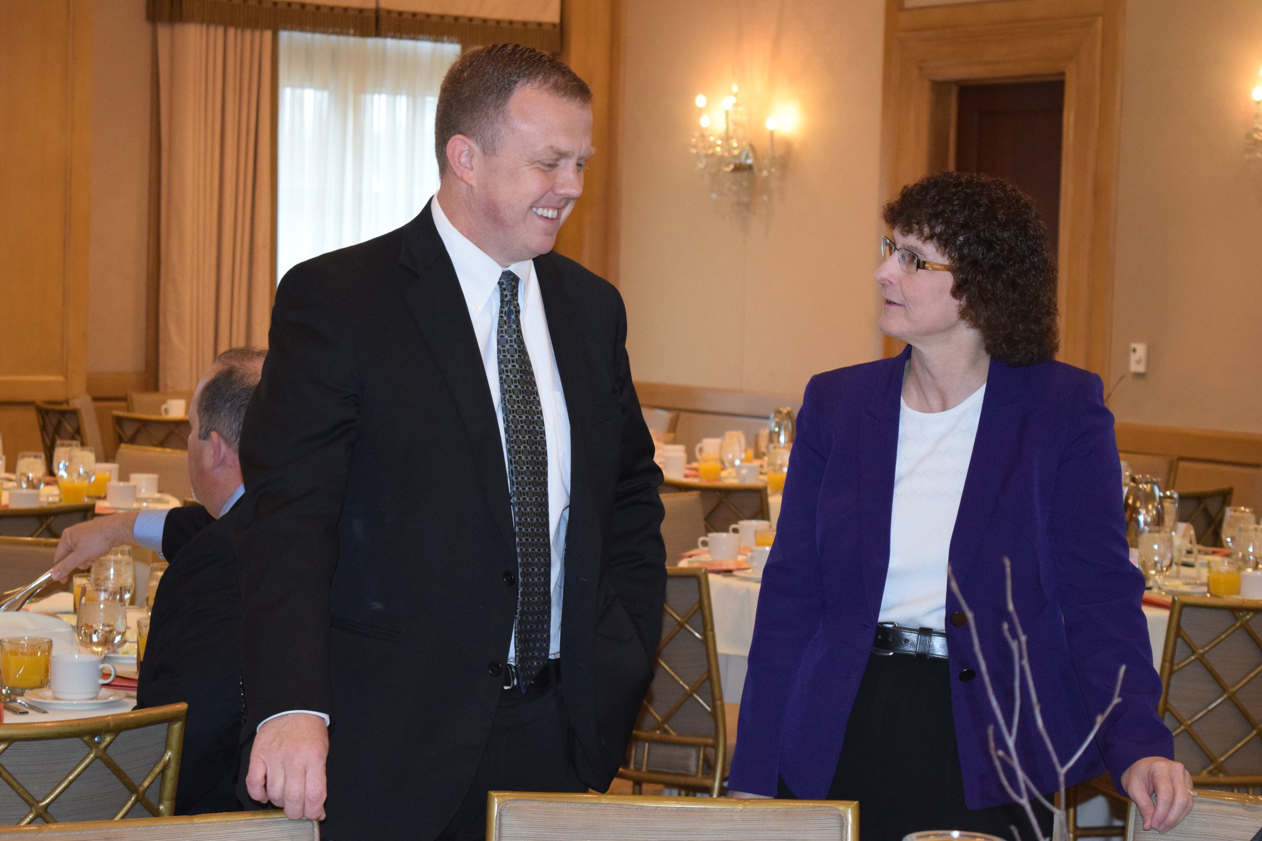  Board member JD Carlson speaks to one of his guests. 