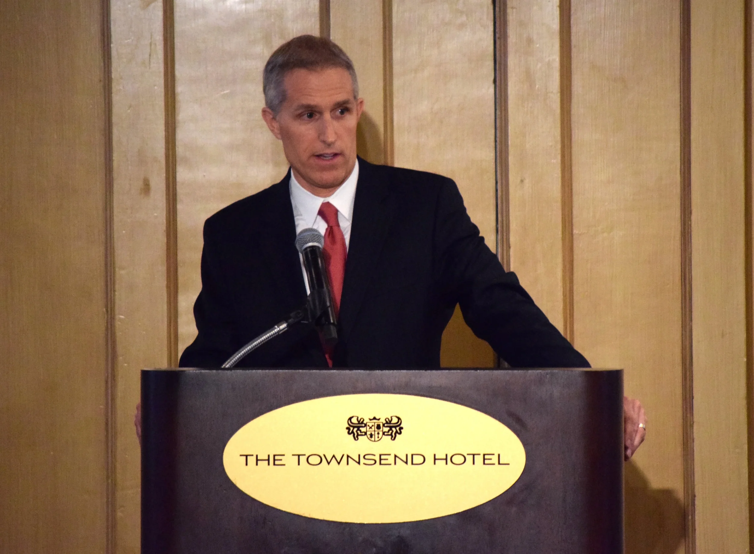 Board Chairman Paul DeRoche speaks to the crowd.