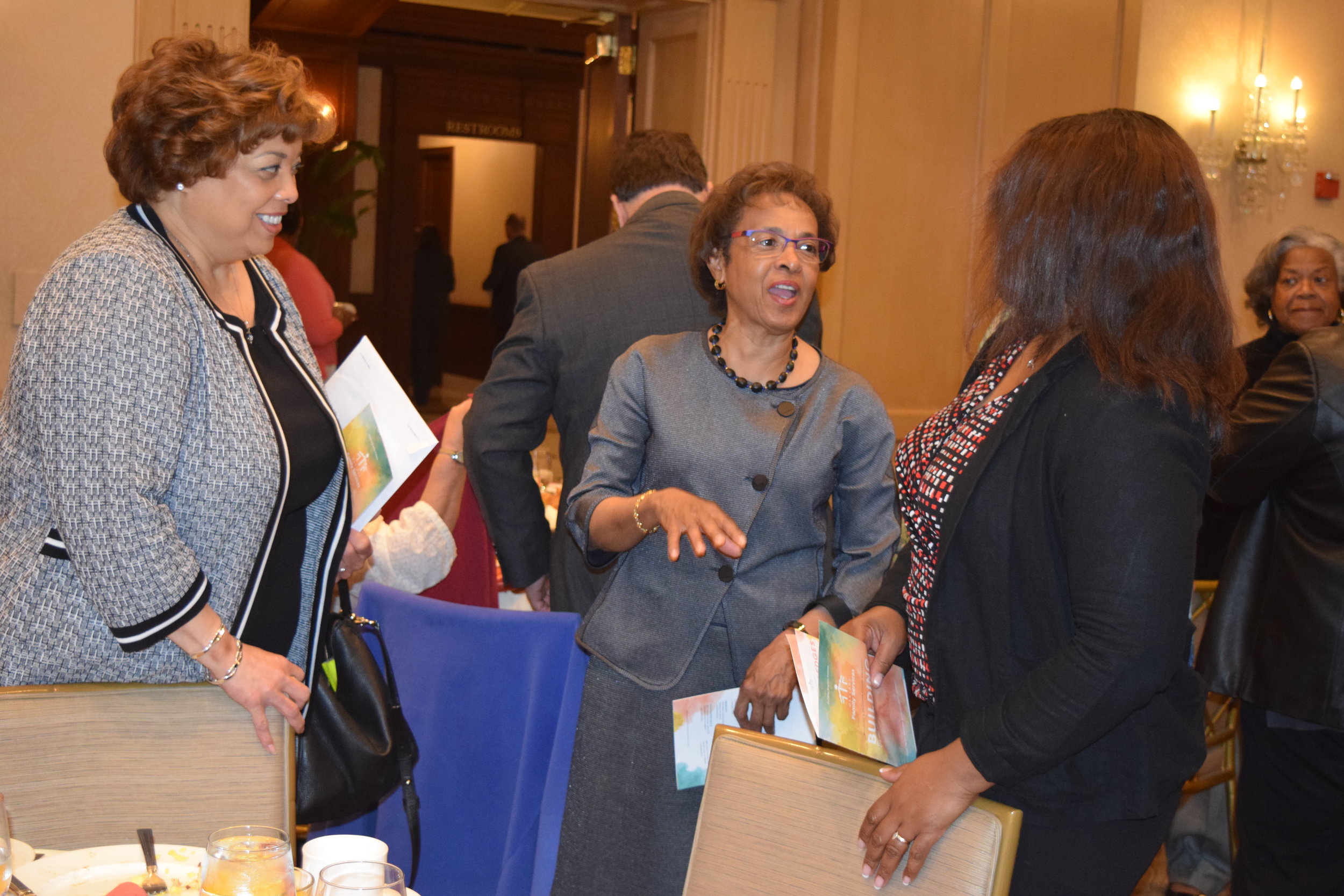  Board member Joya Shepard engages with other guests at the breakfast. 