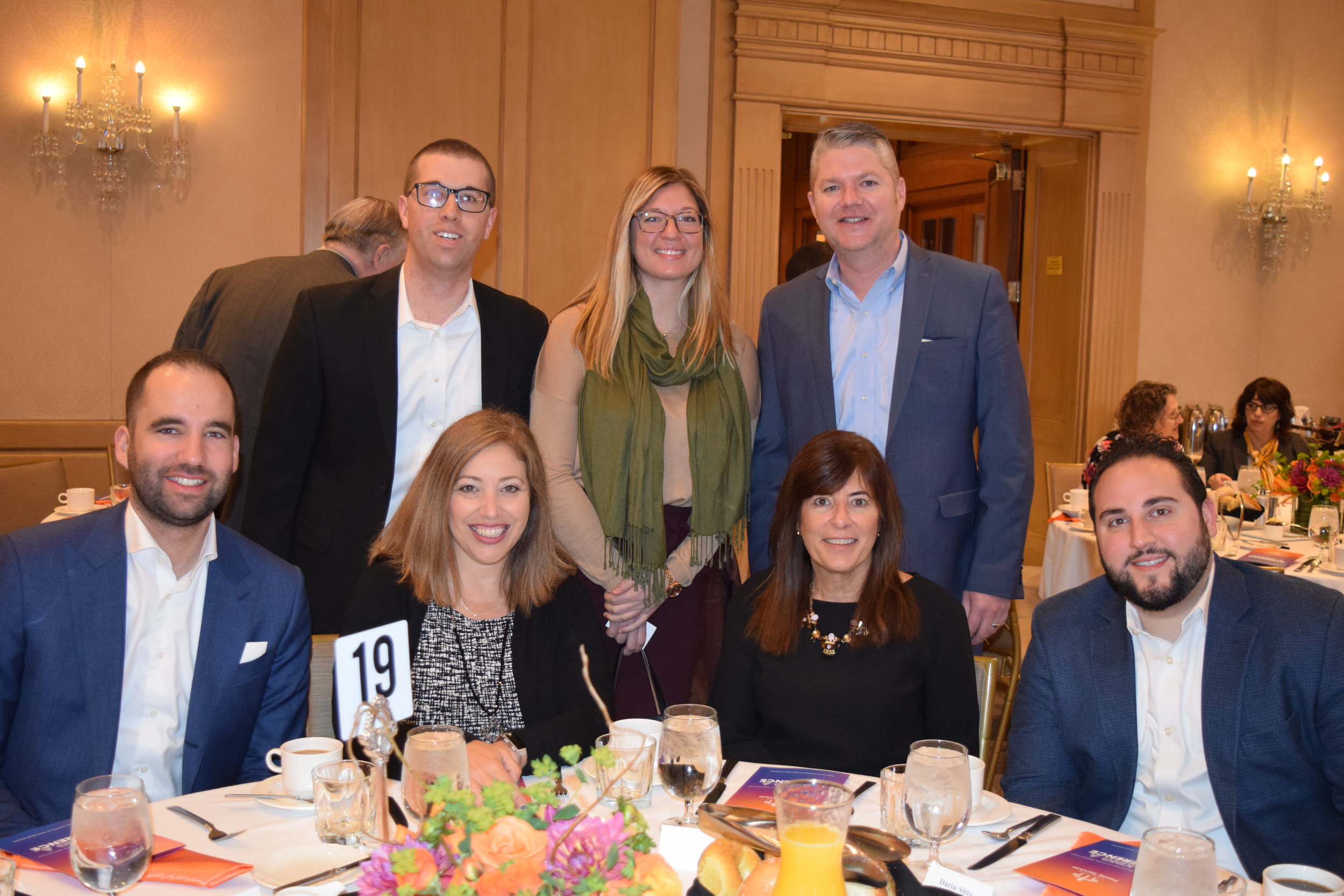 Representatives of breakfast sponsor KPMG, including board member Betsy Meter (front, second from right) attended the event.