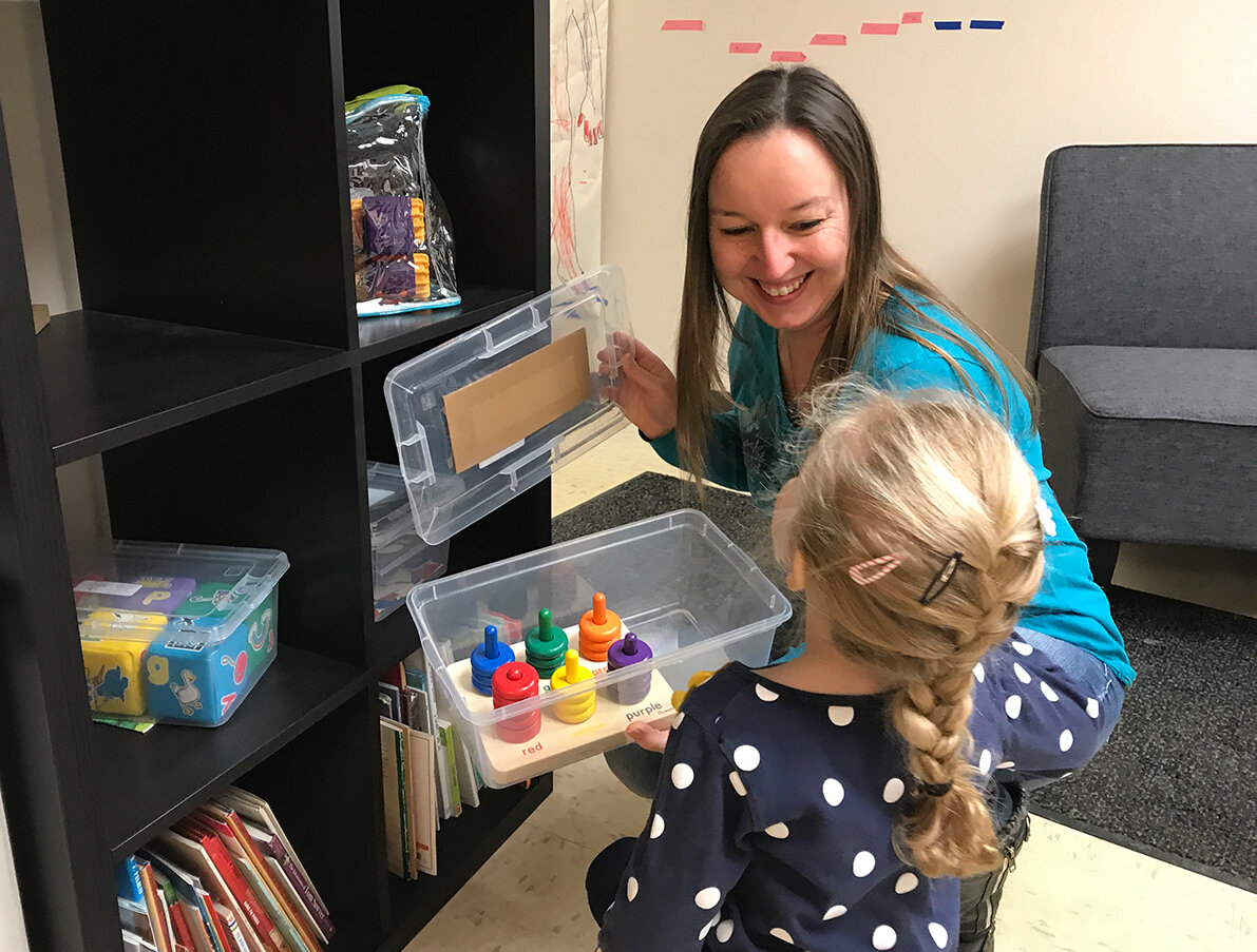  A mother and daughter check out items in the Early Learning Communities’ Lending Library in Walled Lake in January 2020. 