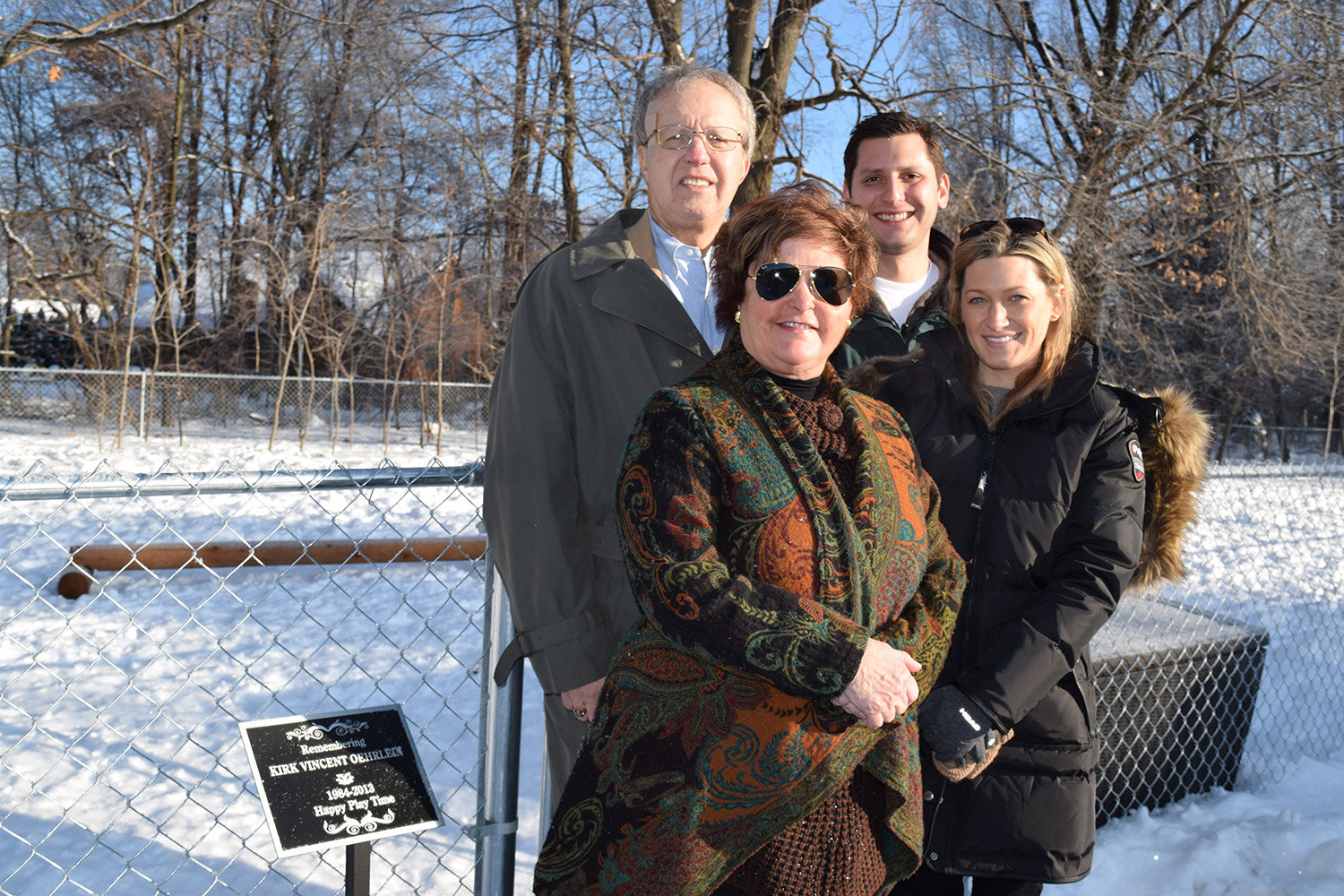  The family of Kirk V. Oehrlein stands near the natural playground at the Walled Lake Children’s Learning Center at the center’s ribbon-cutting in 2015. The playground is dedicated to Oehrlein’s memory. 
