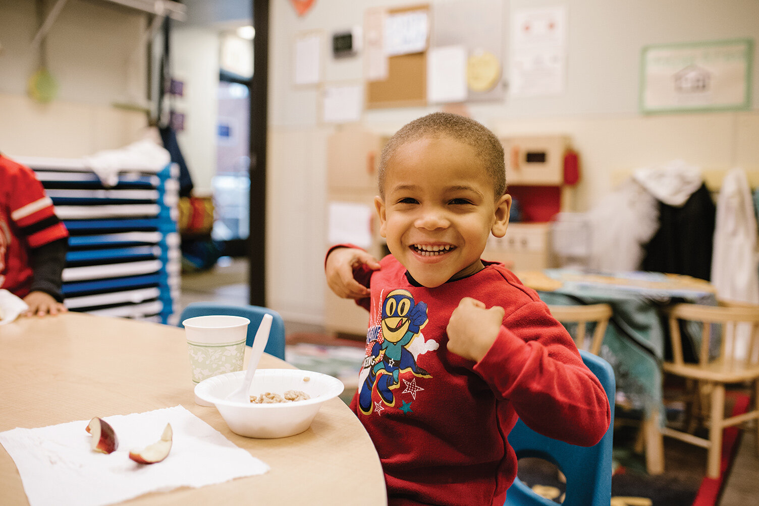  A preschooler eats breakfast at the Pontiac Children’s Learning Center in 2016. 