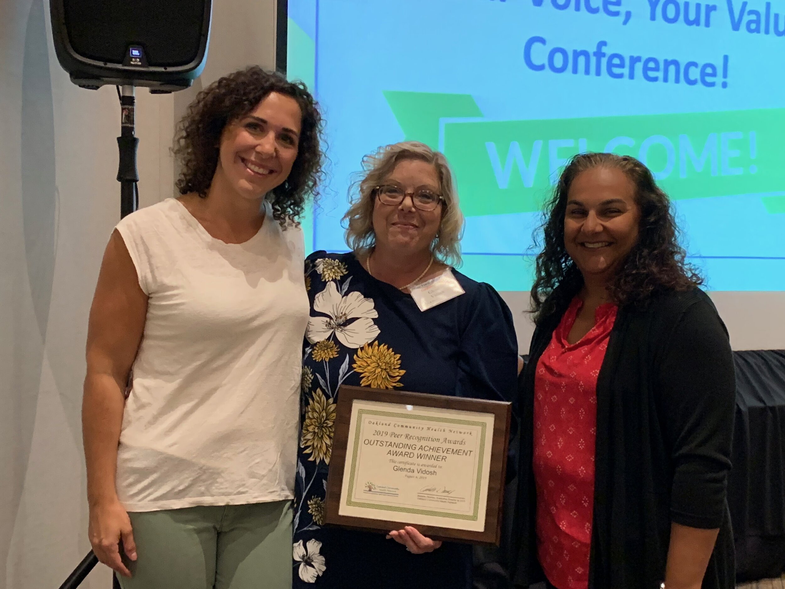  Specialized Services for Youth’s Certified Parent Support Partner/Community Liaison Glenda Vidosh (center) is recongized for her outstanding achievement in peer support at  Oakland Community Health Network’s Your Value, Your Voice conference in 2019