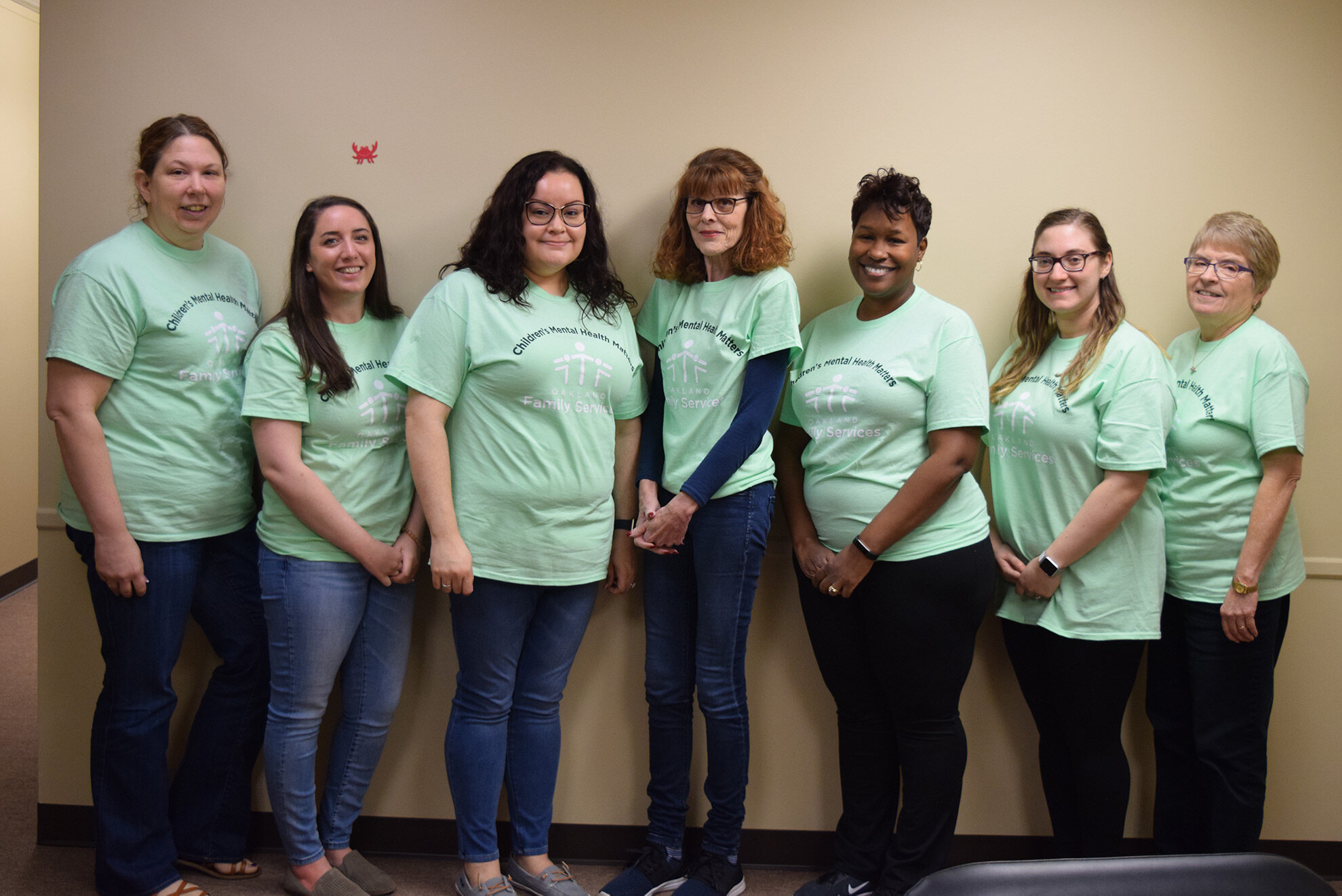  Staff celebrate Children’s Mental Health Awareness Day in 2019 at Oakland Family Services’ Walled Lake office. 