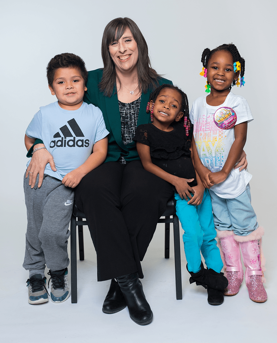  Current President and CEO Jaimie Clayton is pictured with students from the Pontiac Children’s Learning Center in 2018. 