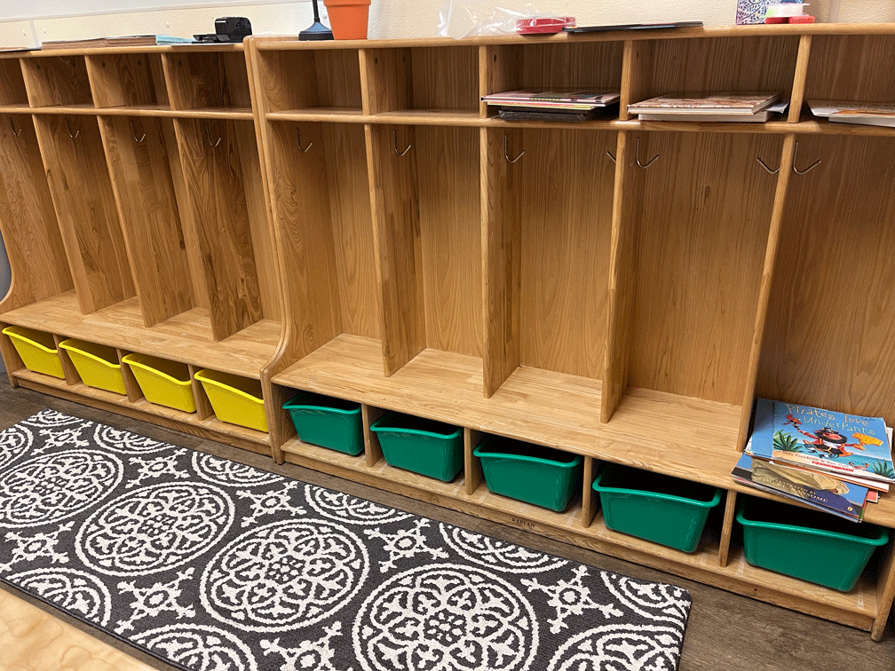  Children store their backpacks and other belongings in cubbies in or near their classrooms. 