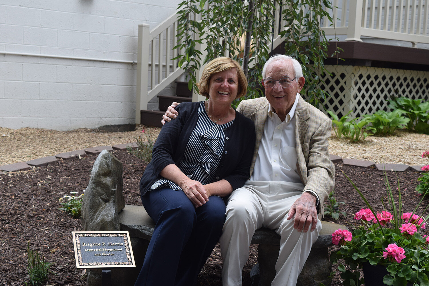  1.&nbsp;&nbsp;&nbsp;&nbsp; Brigitte Harris’ daughter and husband, Michele Becker and Mort Harris, are pictured at the 2017 dedication of the Brigitte P. Harris Memorial Playground and Garden at Oakland Family Services’ Pontiac location. 