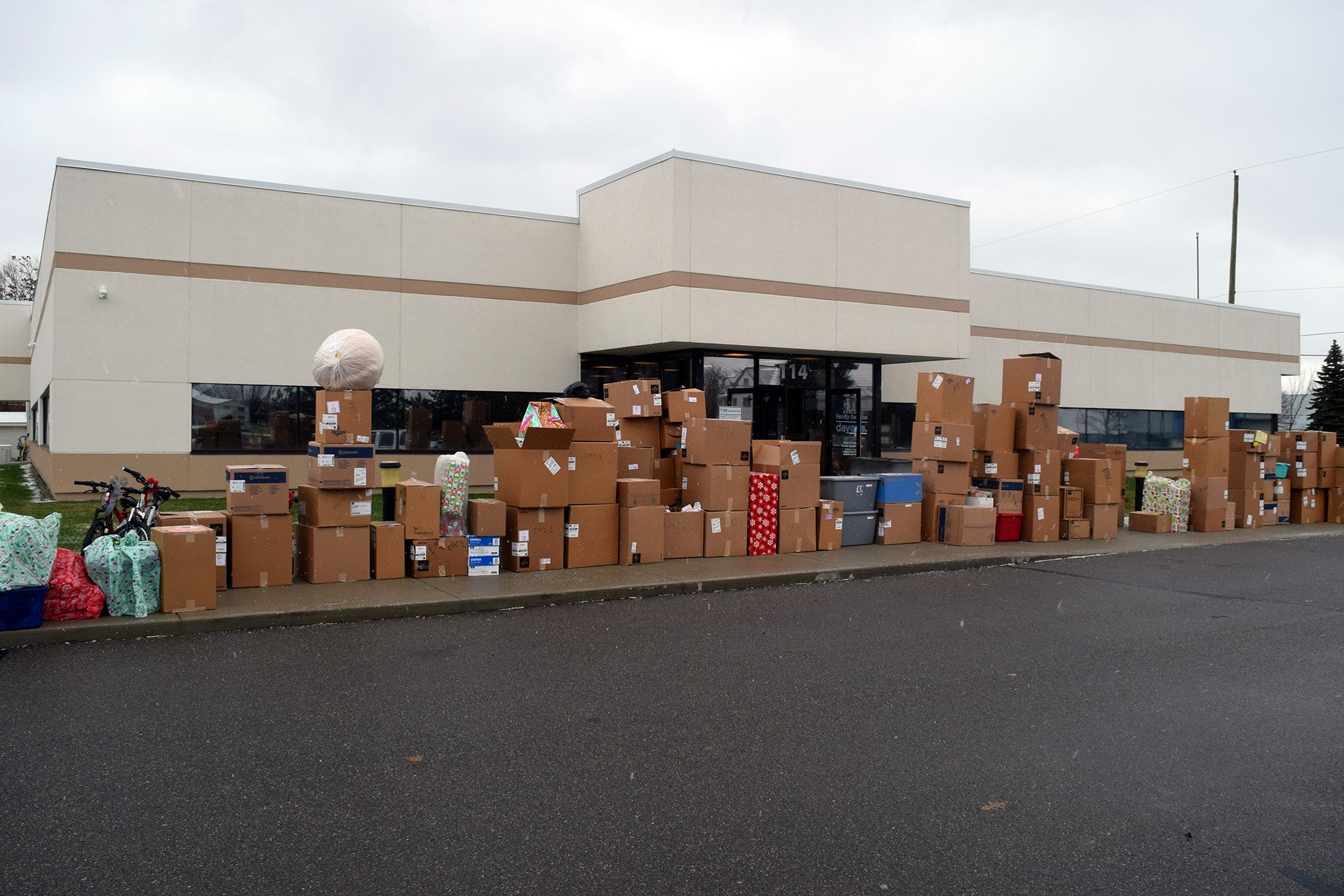  Adopt A Family gifts are lined up outside of Oakland Family Services’ Pontiac office in 2019, the last year the agency was able to collect physical gifts. This year marks an exciting return to Adopt A Family tradition! 