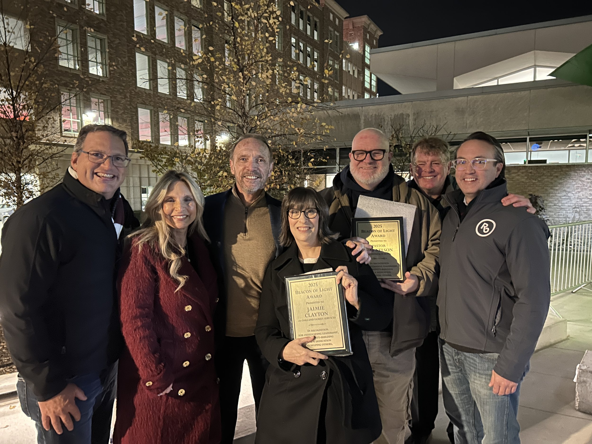 Jaimie Clayton receives Beacon of Light award from Oakland County Executive Dave Coulter 