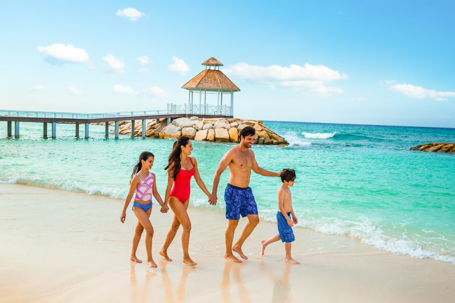 Hyatt-Ziva-Rose-Hall-Family-Walking-Down-Beach.jpg