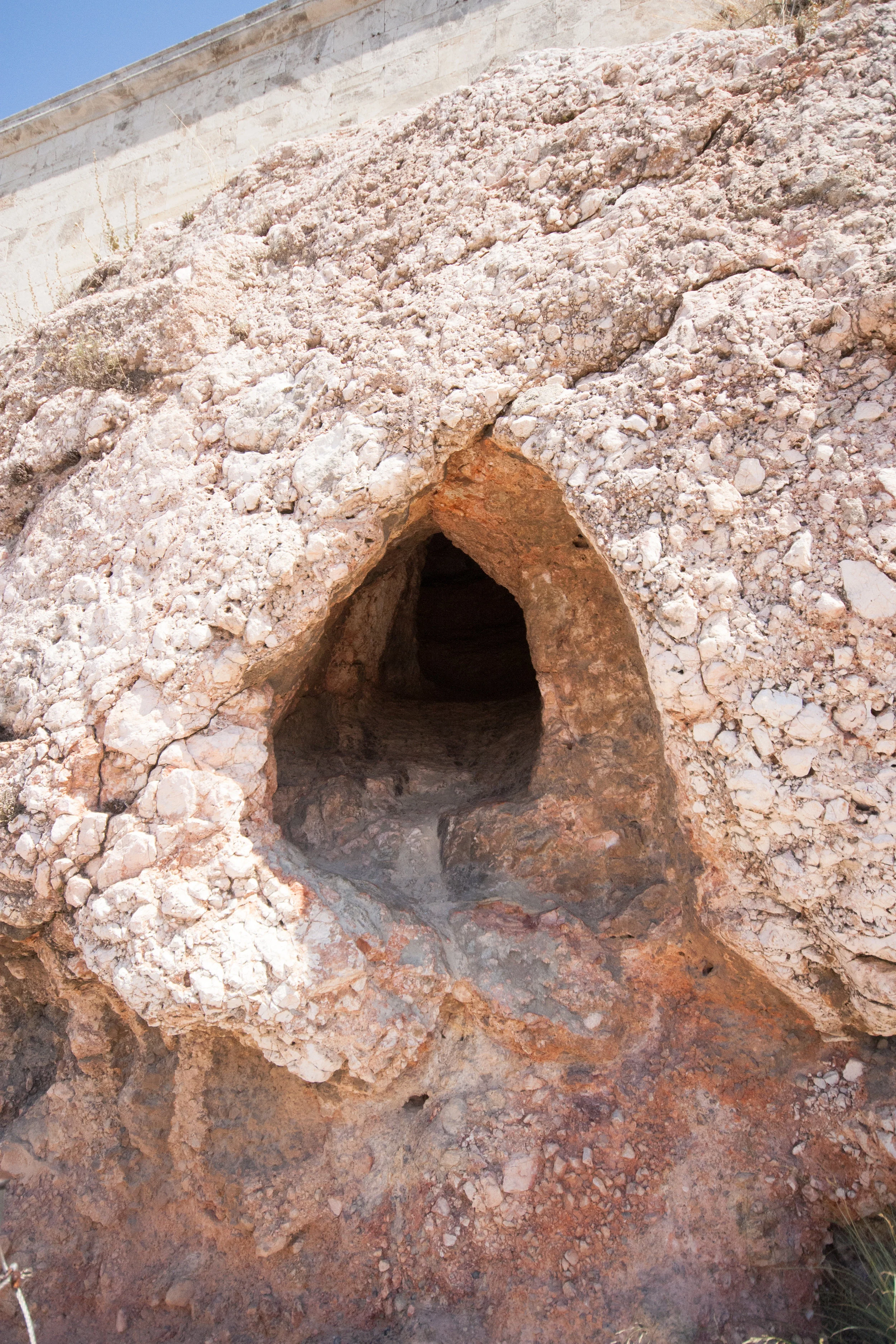 A cave in the wall just after the the Odeum of Herodes Atticus on the way up to the Acropolis.