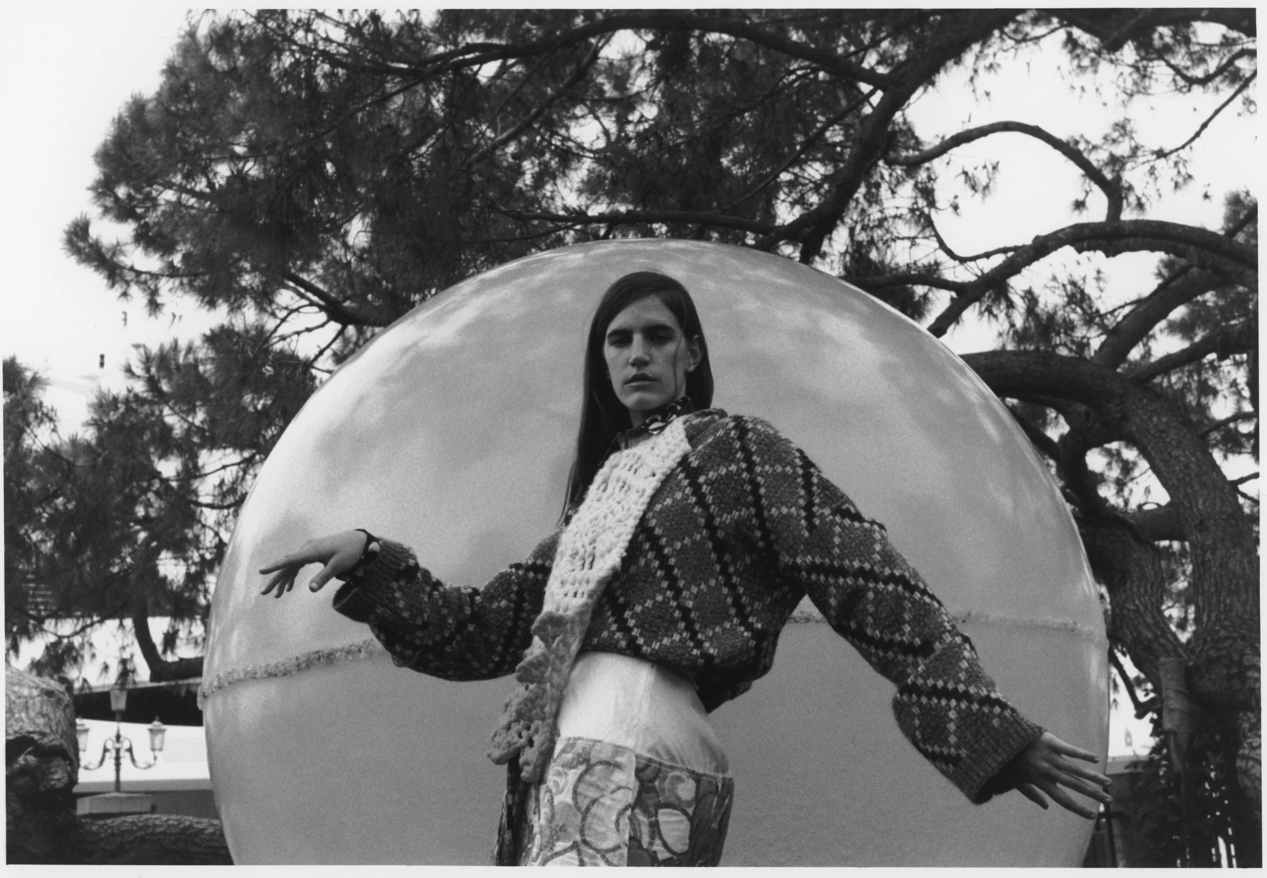 Sweater by Loewe. Shirt by Katharine Hamnett. Bib by Congregation. Skirt by Marni. ‘The Sphere 3D Spectrum’, by Clifton Mahangoe. Photography: Jack Symes. Fashion: Marianthi Hatzikidi