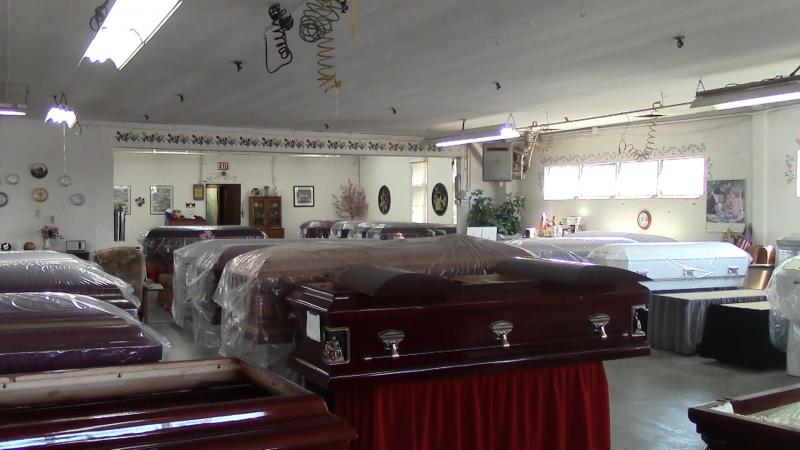 Caskets sold at ABC Caskets, located in Los Angeles, are oftentimes cheaper than those sold at funeral homes. (David Hodari/Neon Tommy)
