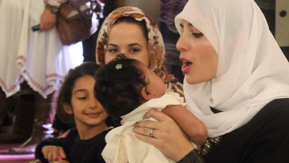 Several women brought their daughters to the inaugural service of the Women's Mosque of America, which took place inside of a Jewish Synagogue. Rebecca Gibian/The GroundTruth Project