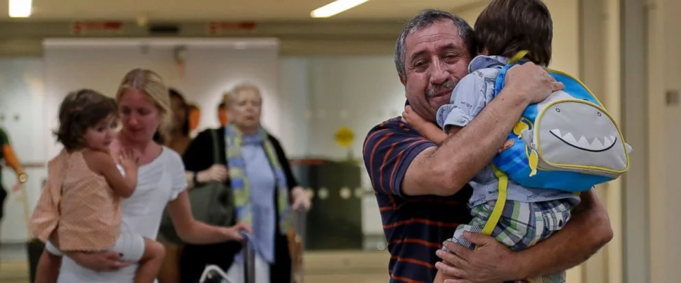 As Puerto Rico reels, lucky few get flights to the mainland