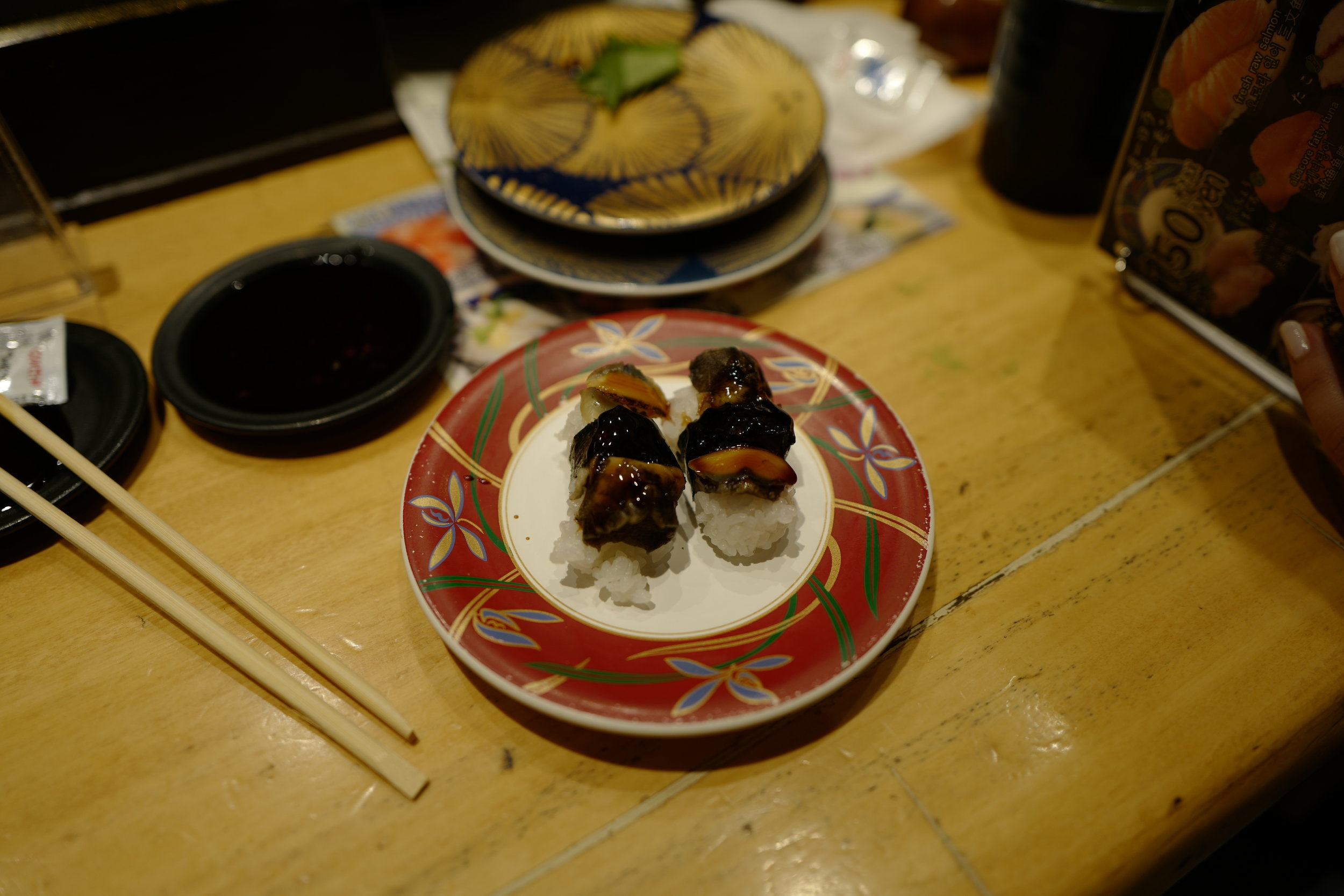  Soooo worth it! Our first pieces were top-notch toro, which we ate too quickly to photograph. This was some welk nigiri that Hunter grabbed next. 