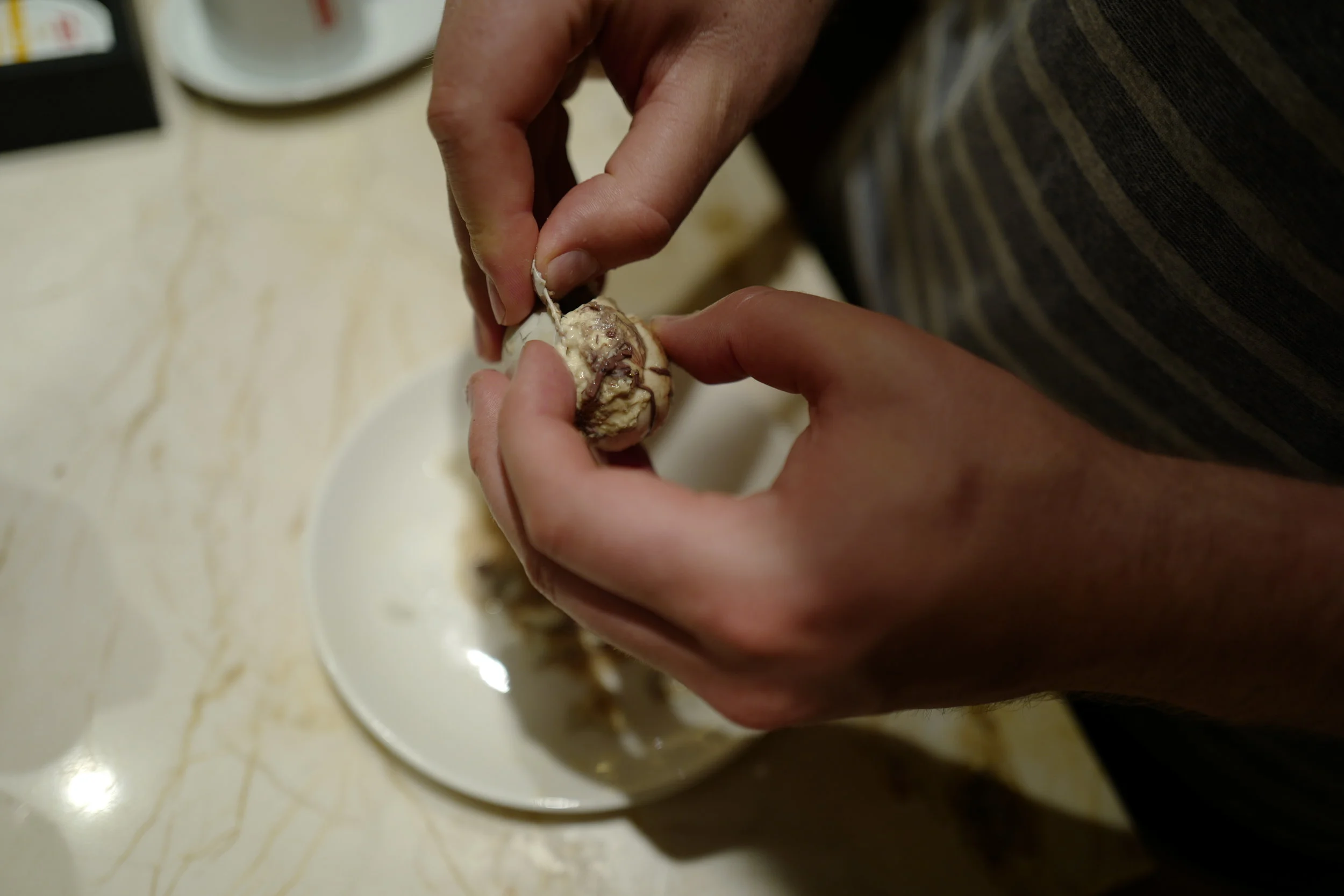  Hunter had to try the balut from a street cart! I think he cheated, cause he popped the whole thing in his mouth, so he didn't have to see the chicken fetus staring up at you. 