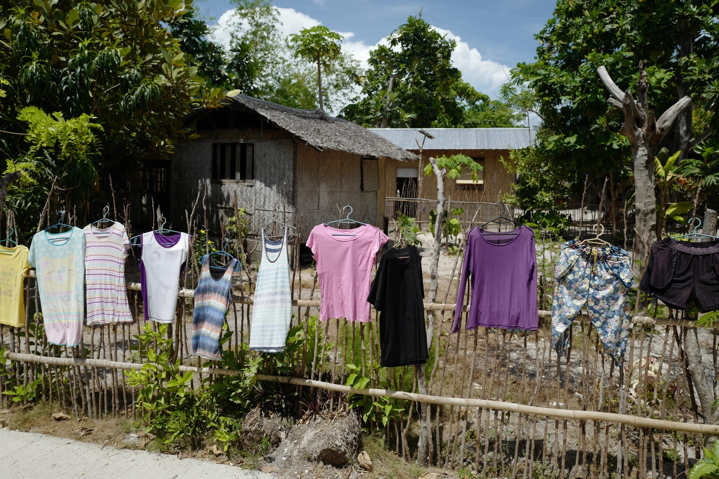  Some laundry hanging out to dry in front of one of the local homes. 