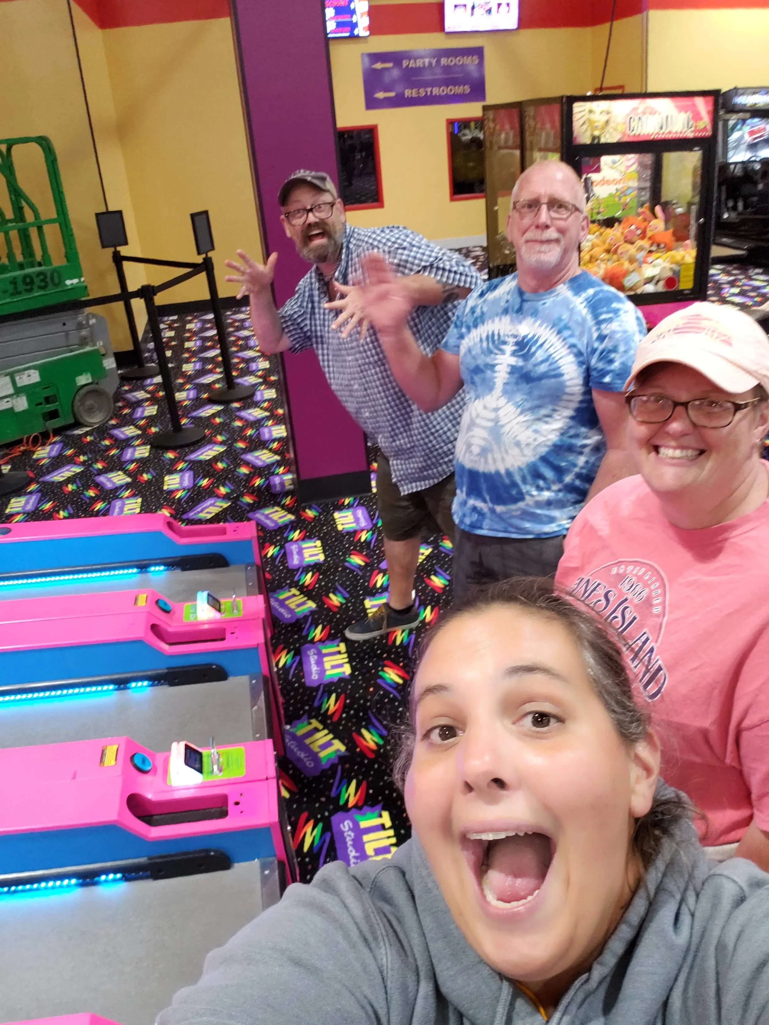 Playing Skee Ball with our buds Mike and Alan.