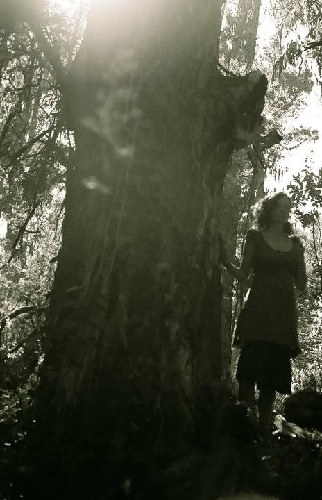 Woman standing in the trees, Golden Gate Park