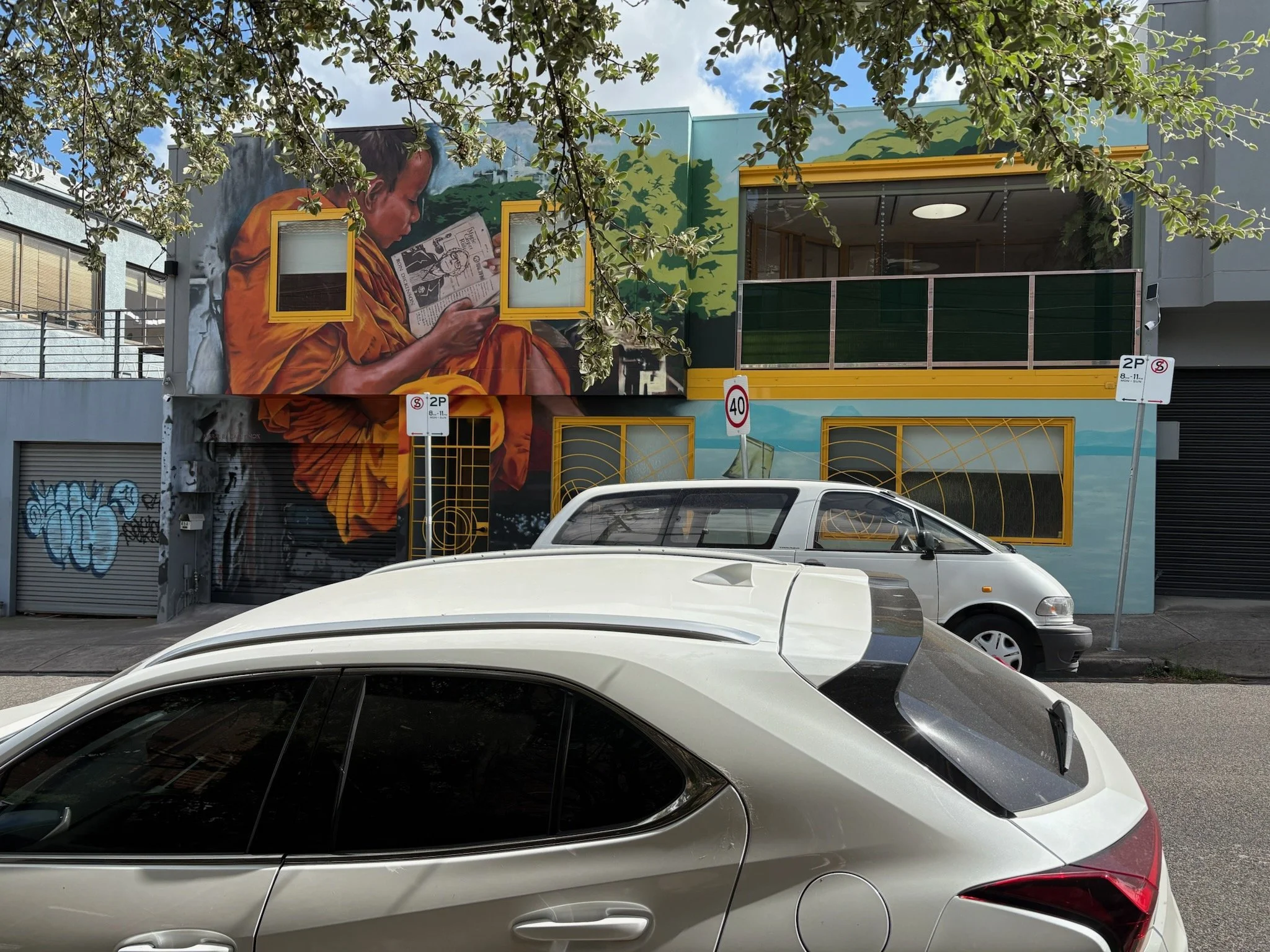 Luxton Architecture — multi-residential project in Northcote Melbourne suburb, contemporary building with street art facade, balcony and decorative security doors and screens