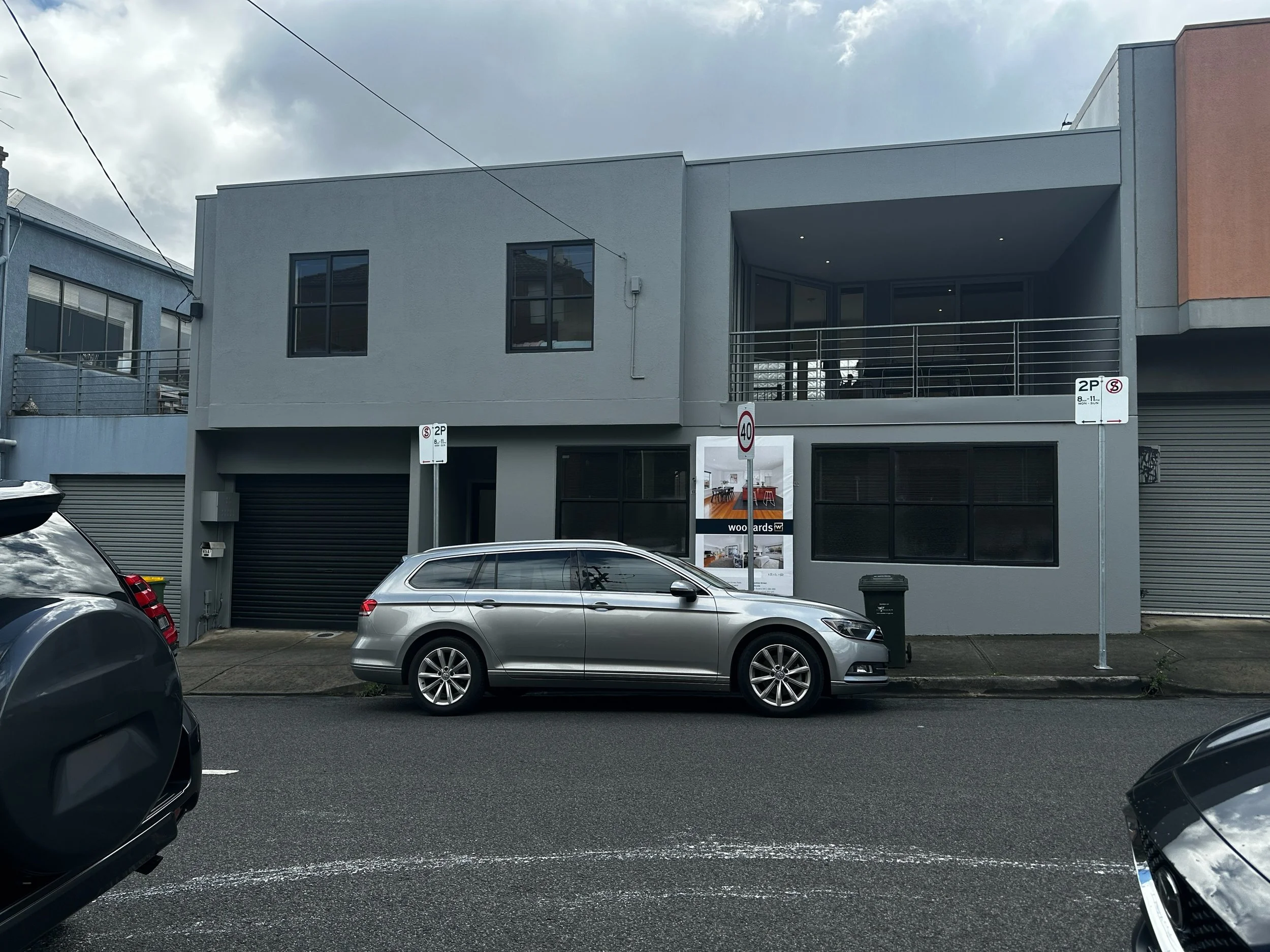 Luxton Architecture — contemporary two-storey townhouse with grey facade and balconies, multi-residential design Melbourne Northcote