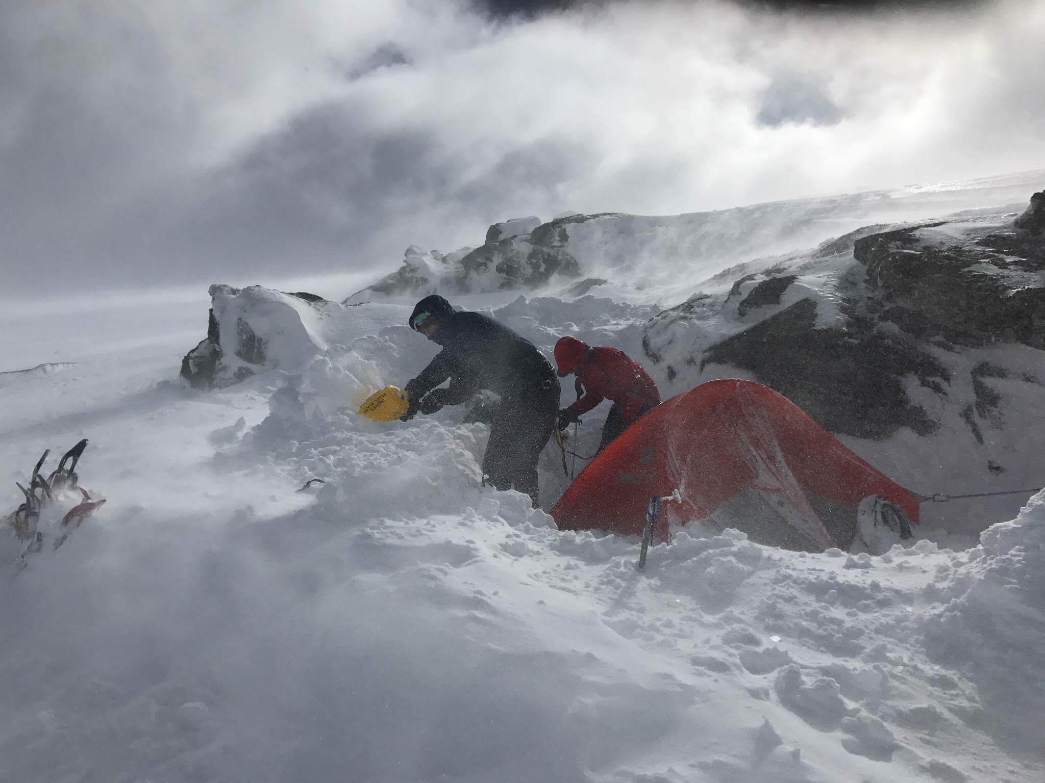 Reinforcing our snow wall in 90+km/hr winds.