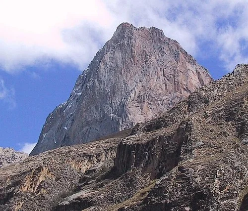The imposing granite monolith La Esfinge in Peru's Paron Valley. Home to several big wall routes and over 5,000m elevation it's original route (750m, 5.11) is on the Vertical Year route list. (Source: La Esfinge SummitPost page)