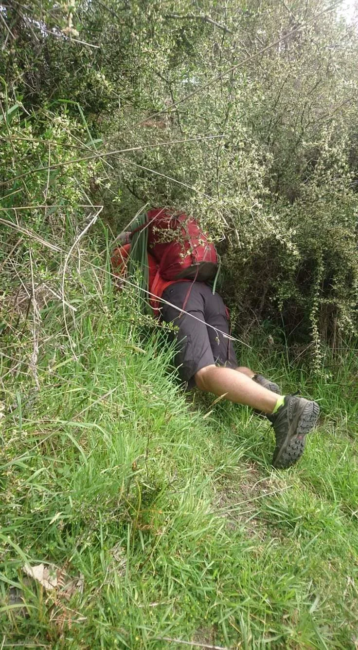 Crawling through thick scrub on our way to the Sundial (photo: Pim Shiatosa).