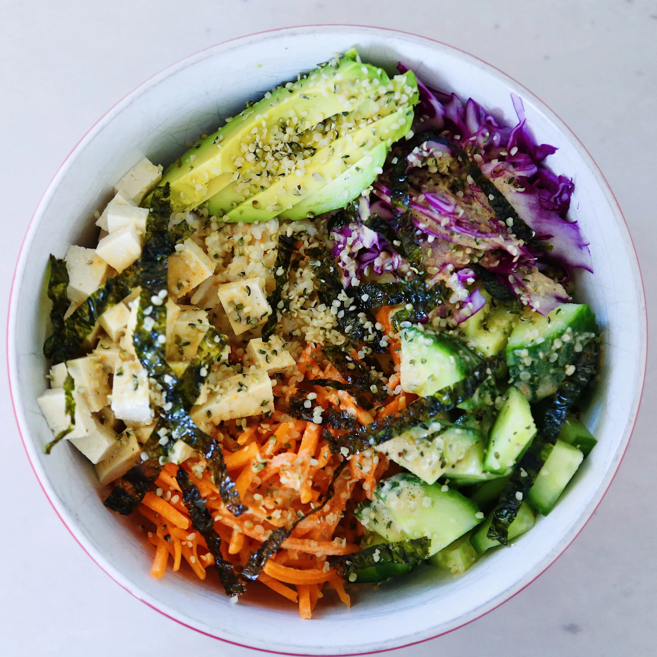 Vegetable-loaded tofu sushi bowl with miso ginger dressing